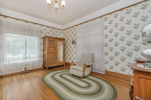a living room with furniture and a rug