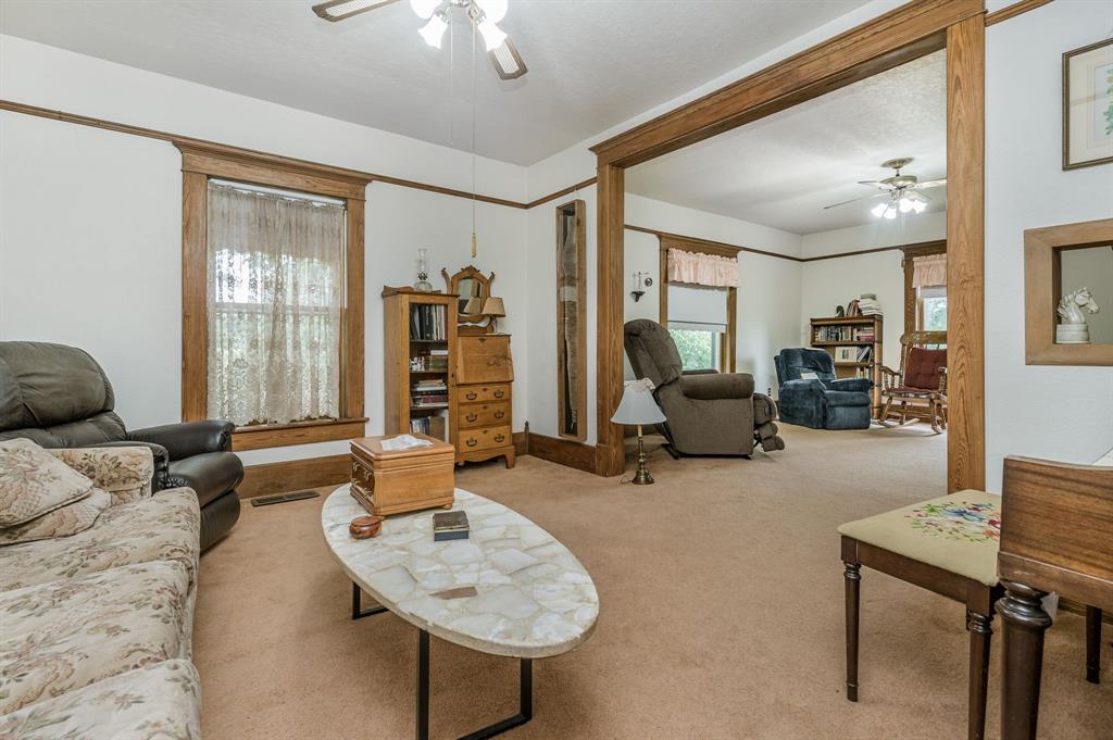 1204 East Cheyenne Avenue Canadian, TX 79014 - Photo 39 of 39 a living room with furniture and a flat screen tv