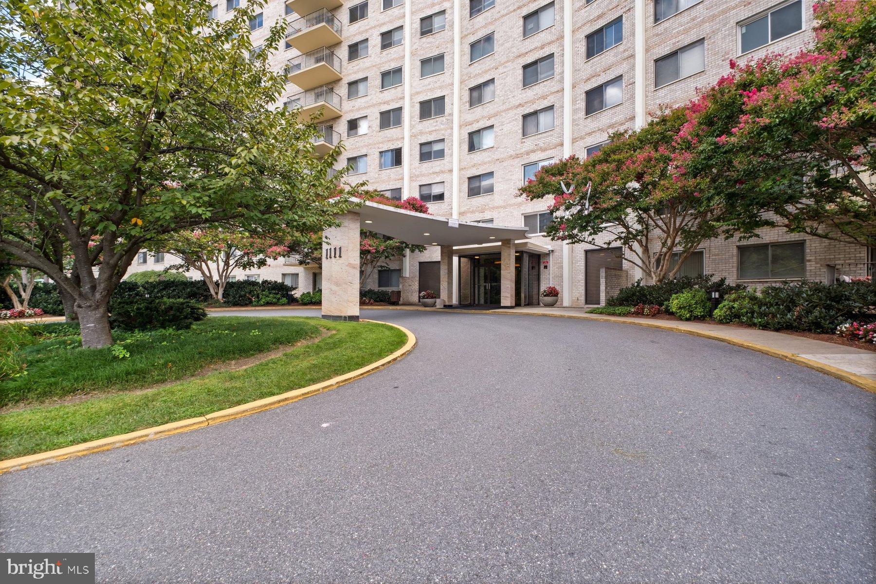 1111 University Boulevard West, Unit 817 Silver Spring, MD 20902 - Photo 3 of 26 a view of building with yard