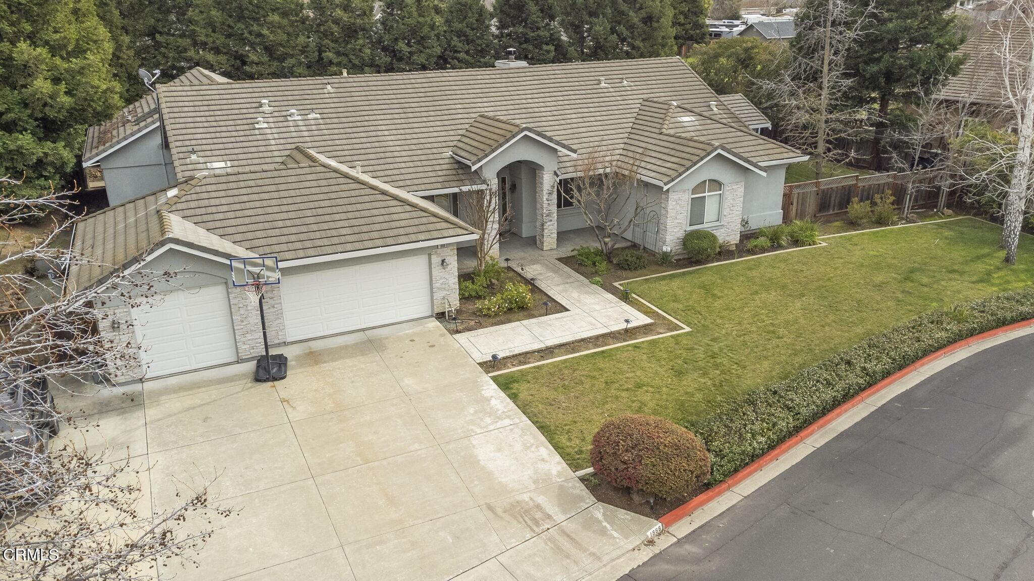1888 Renee Way Concord, CA 94521 - Photo 3 of 75 a view of a white house with a yard plants and large tree