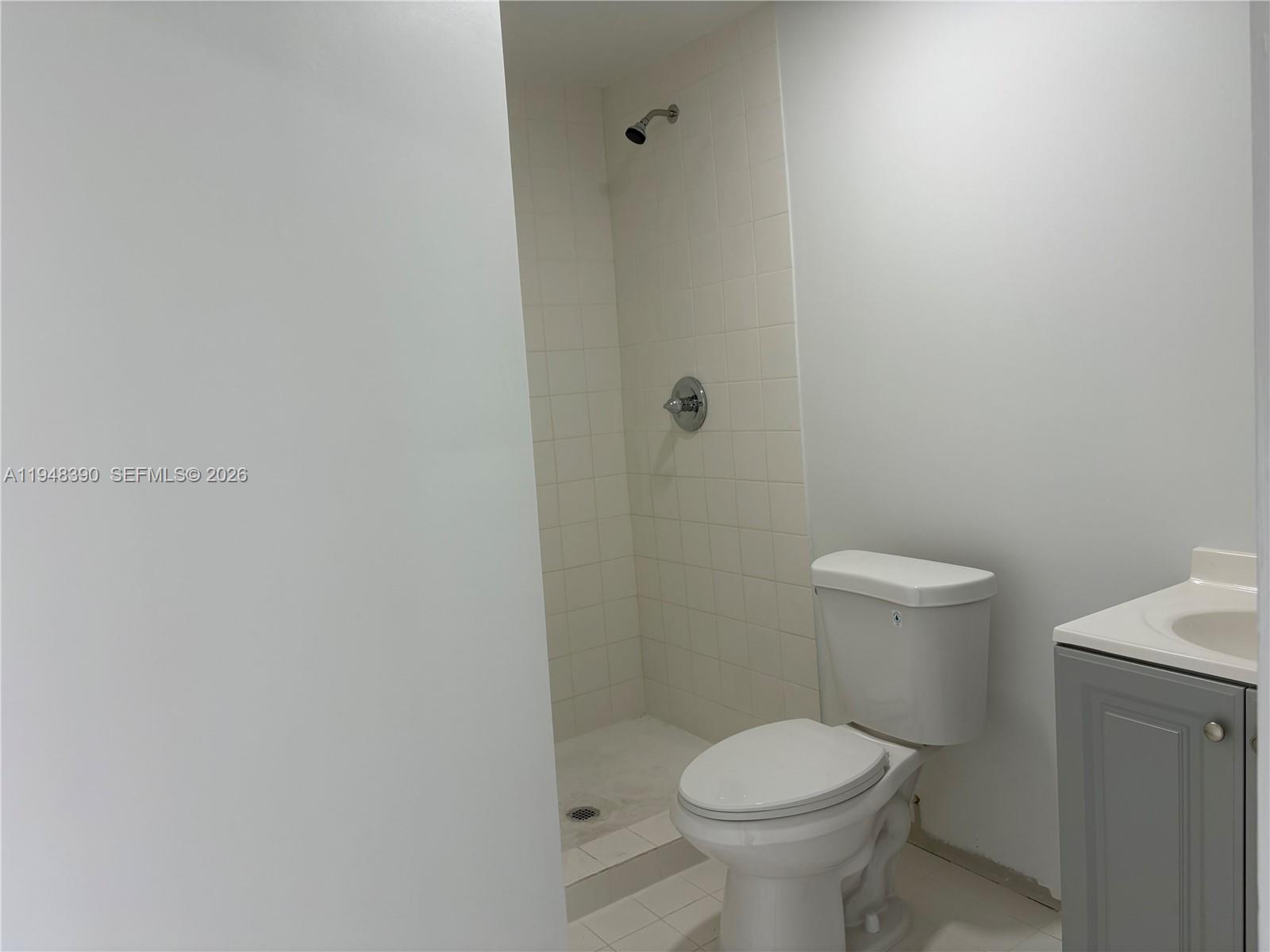 330 North 69th Way Hollywood, FL 33024 - Photo 15 of 20 a white toilet sitting next to a white sink