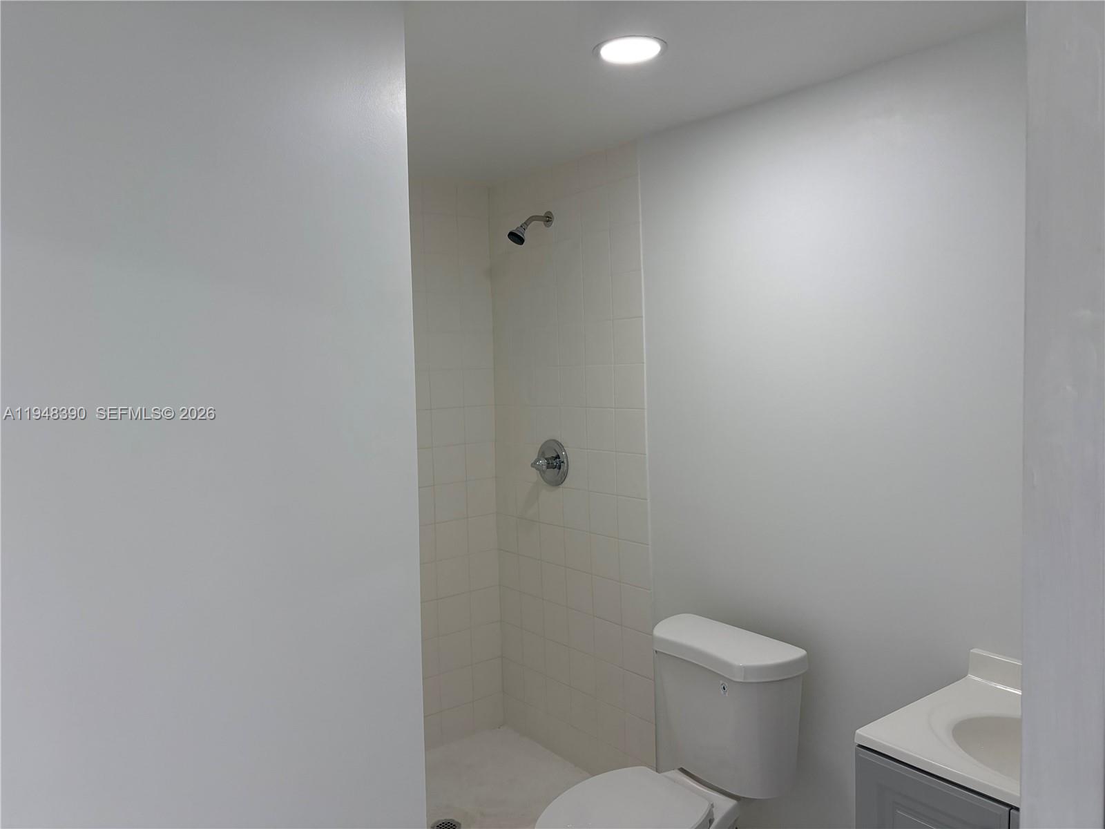 330 North 69th Way Hollywood, FL 33024 - Photo 16 of 20 a white toilet sitting next to a white sink and vanity