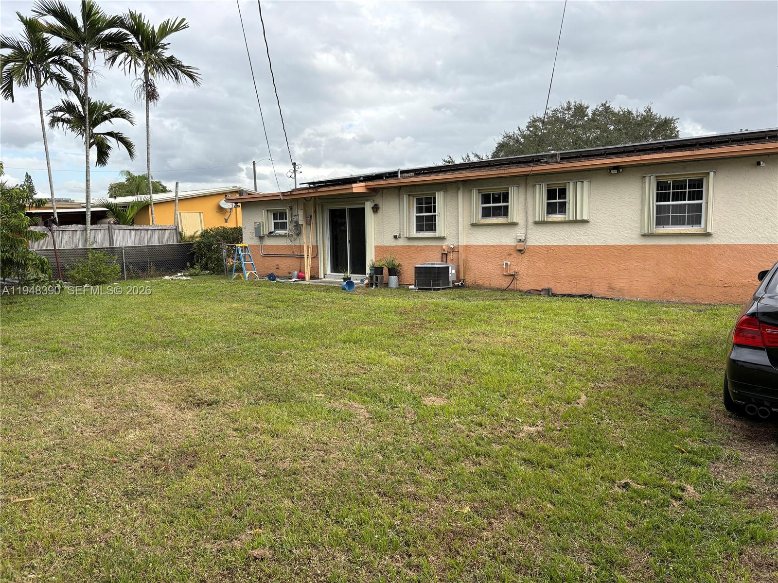330 North 69th Way Hollywood, FL 33024 - Photo 18 of 20 a front view of house with yard and seating area