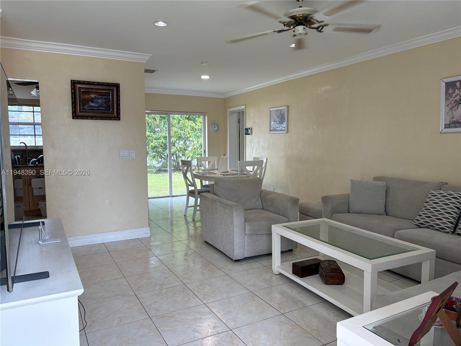 330 North 69th Way Hollywood, FL 33024 - Photo 2 of 20 a living room with furniture and a window