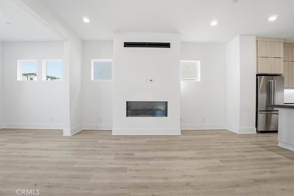 8 Remy Lane Montebello, CA 90640 - Photo 13 of 61 a view of a refrigerator in kitchen and wooden floor