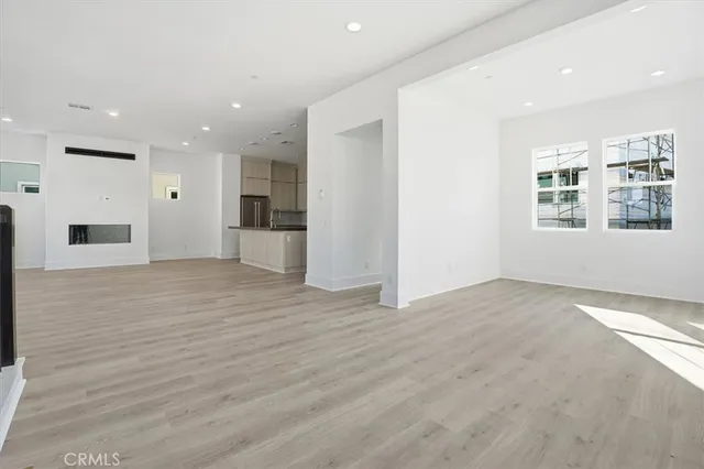 a bathroom with a toilet sink vanity and mirror