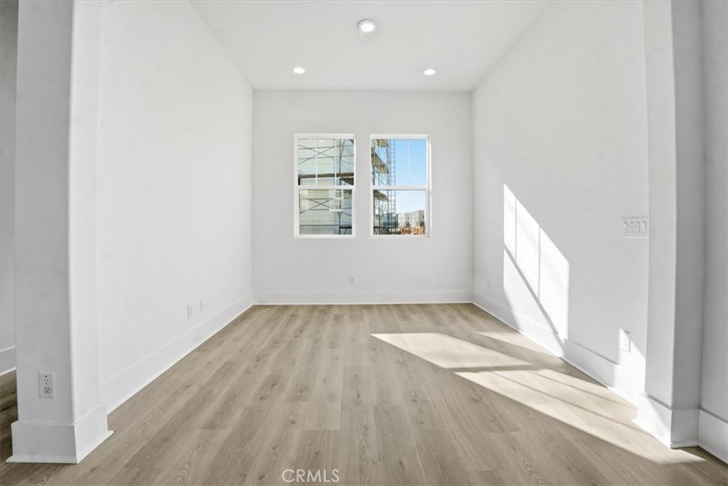 8 Remy Lane Montebello, CA 90640 - Photo 17 of 61 an empty room with wooden floor and windows