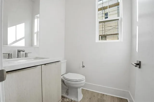 a view of staircase with railing and white walls