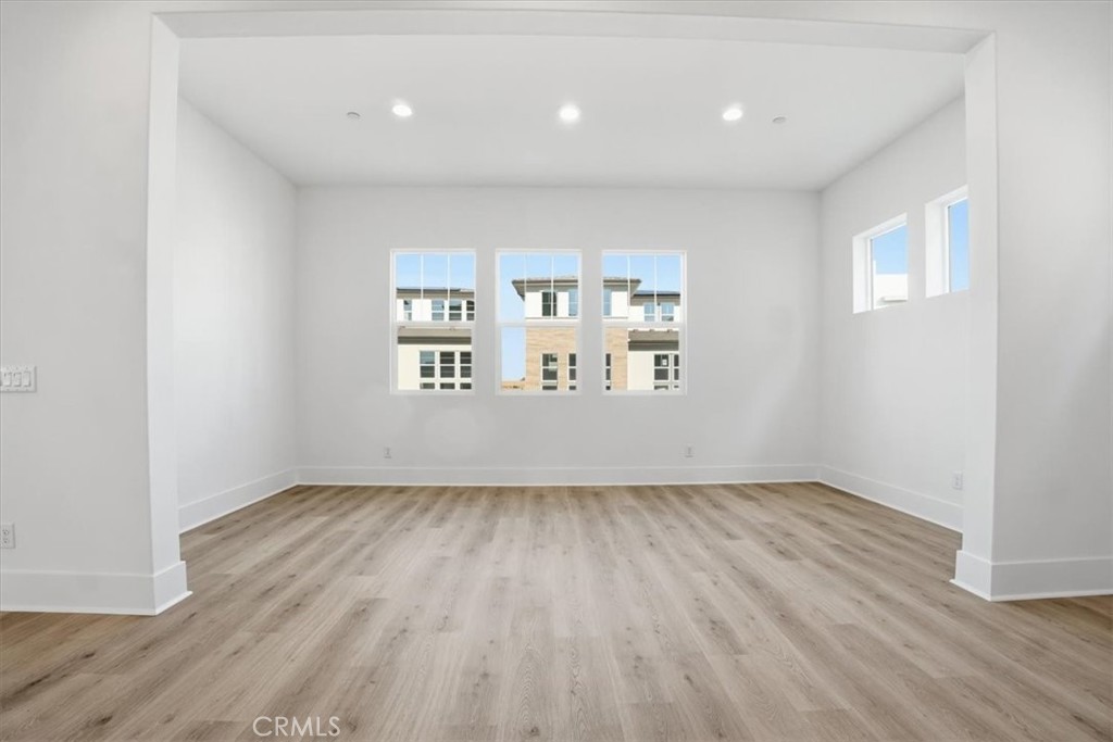 8 Remy Lane Montebello, CA 90640 - Photo 29 of 61 an empty room with wooden floor and windows
