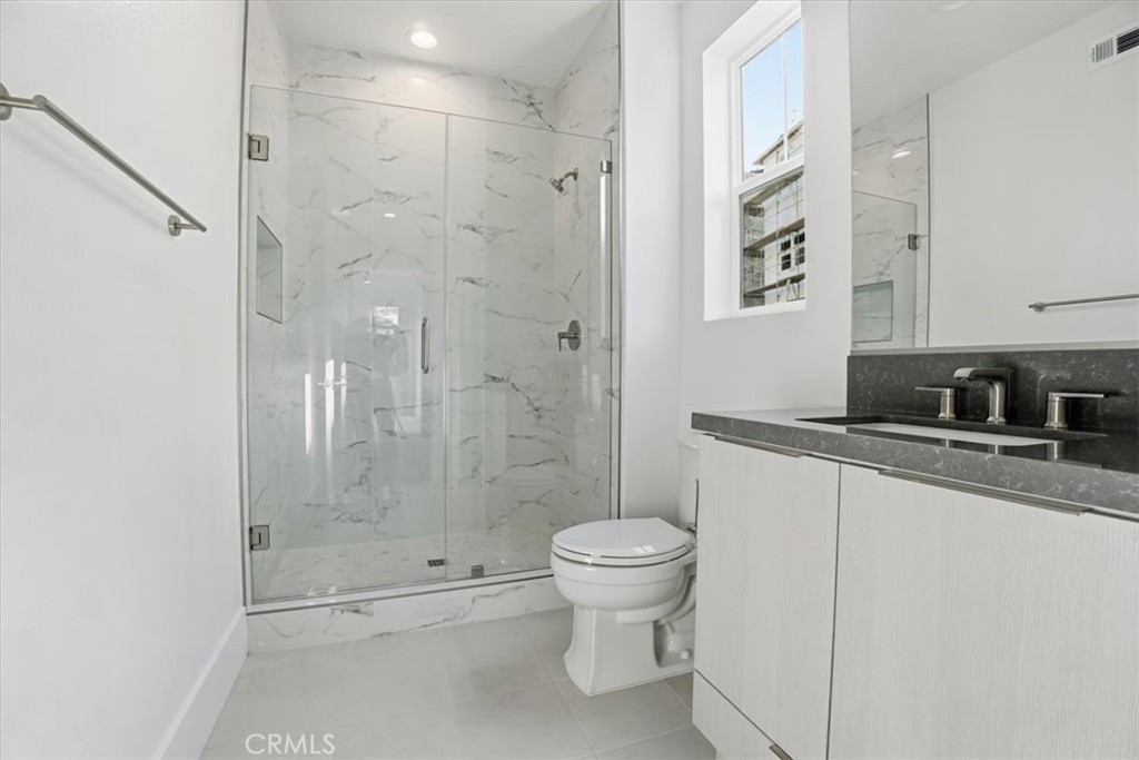 8 Remy Lane Montebello, CA 90640 - Photo 30 of 61 a bathroom with a shower toilet and sink