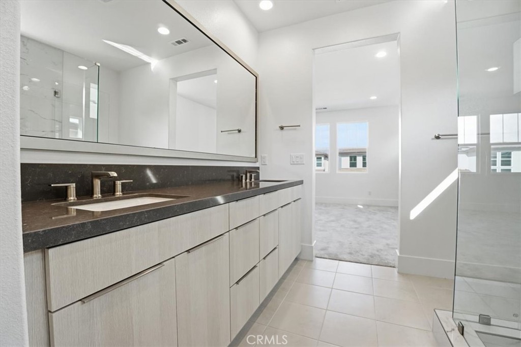 8 Remy Lane Montebello, CA 90640 - Photo 44 of 61 a bathroom with a sink and a mirror