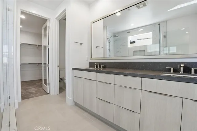 a bathroom with a sink and mirror