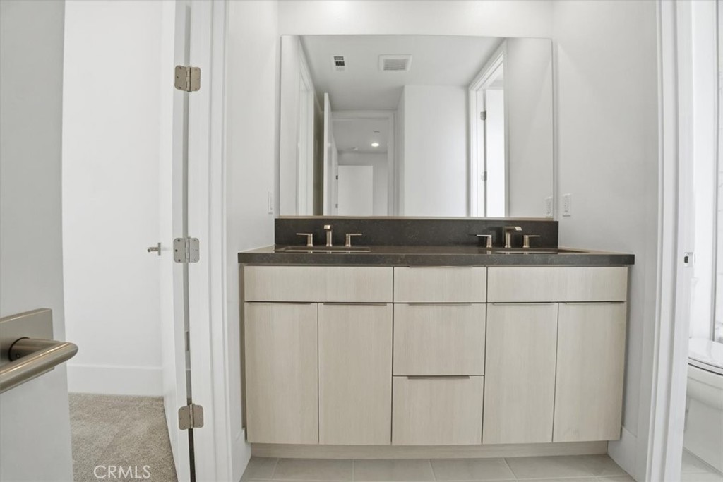 8 Remy Lane Montebello, CA 90640 - Photo 53 of 61 a bathroom with a sink and a mirror