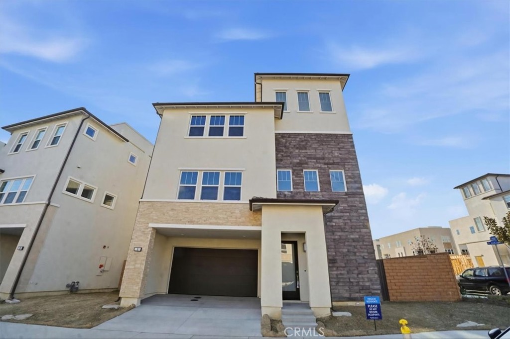 8 Remy Lane Montebello, CA 90640 - Photo 58 of 61 a front view of a house with a garage