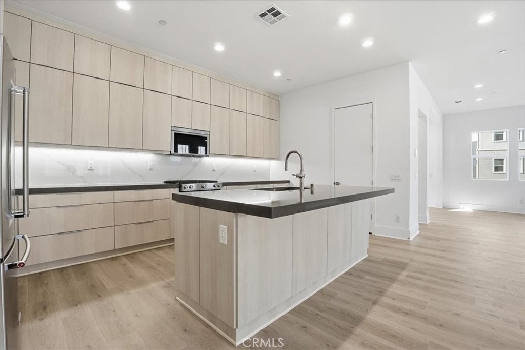 8 Remy Lane Montebello, CA 90640 - Photo 6 of 61 a kitchen with granite countertop a sink and cabinets