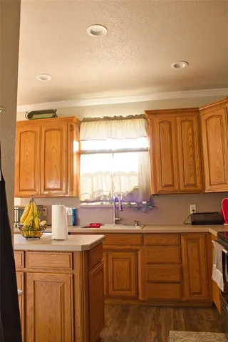 a kitchen with stainless steel appliances granite countertop a sink and cabinets