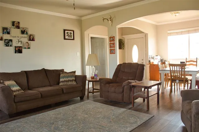 a living room with furniture and a table