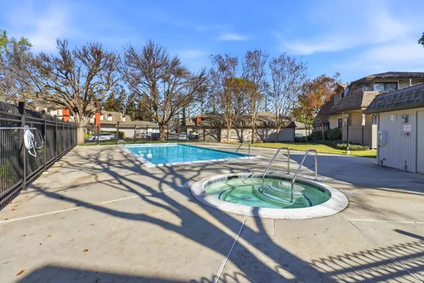 a view of a water fountain and a big yard