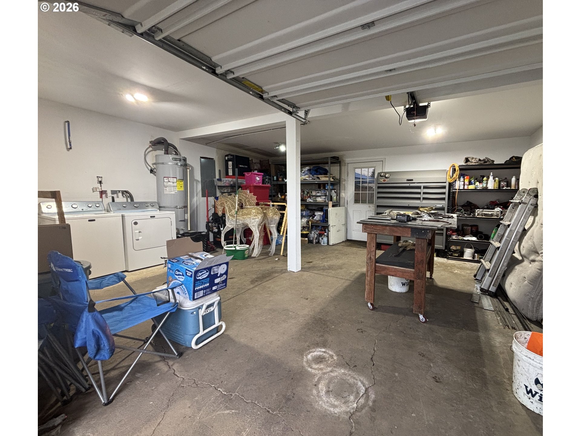 337 Cypress Street Longview, WA 98632 - Photo 13 of 16 a living room with lots of furniture and gym equipment