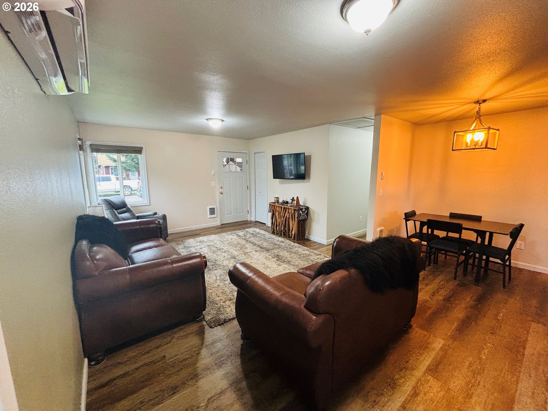337 Cypress Street Longview, WA 98632 - Photo 4 of 16 a living room with furniture and a flat screen tv