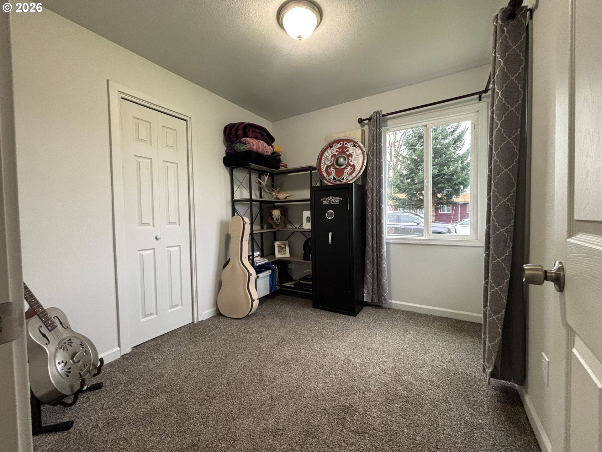 337 Cypress Street Longview, WA 98632 - Photo 10 of 16 a view of an empty room with a window and storage