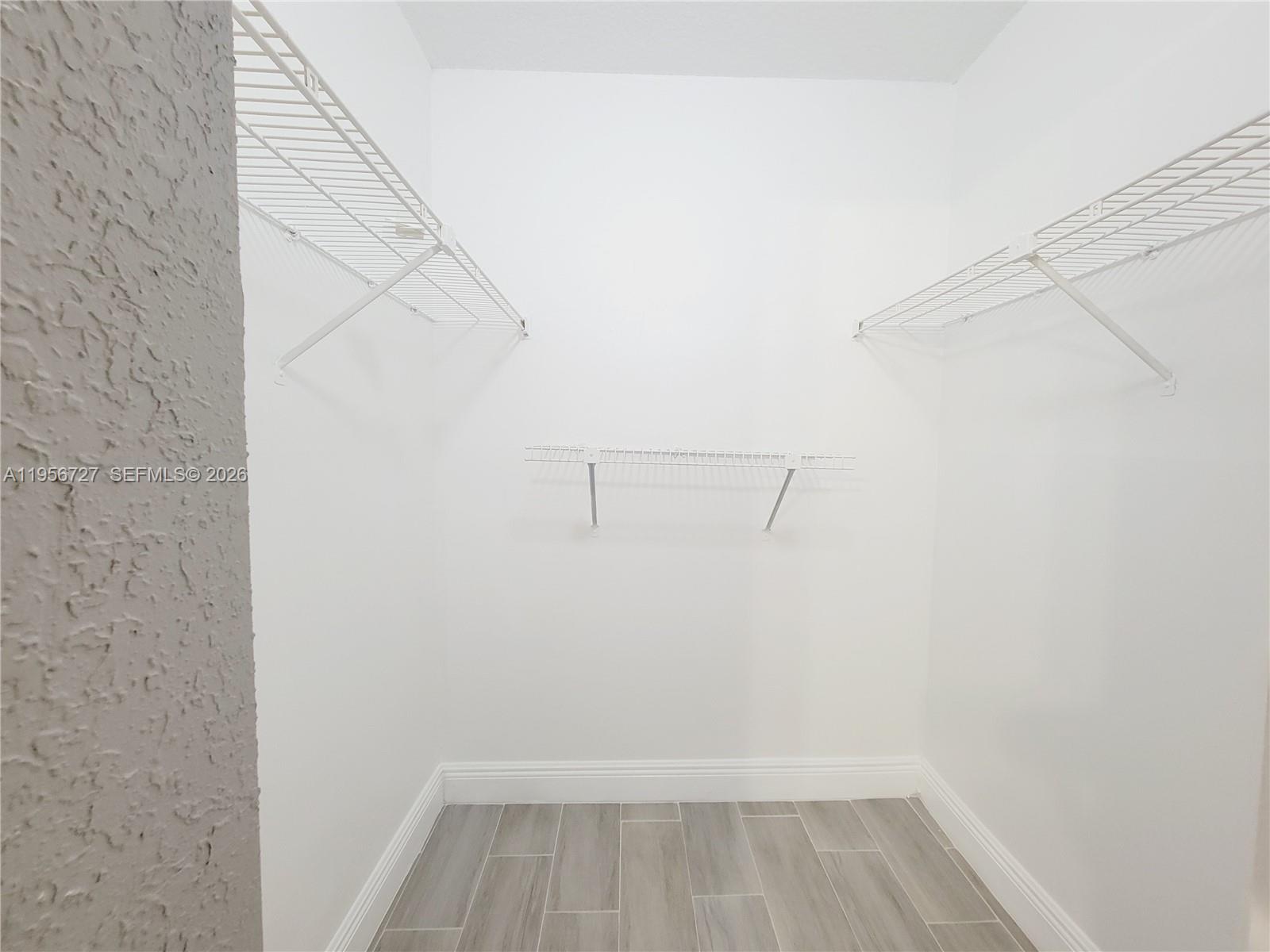 7900 Northwest 50th Street, Unit 108 Lauderhill, FL 33351 - Photo 11 of 18 a view of small space with empty racks