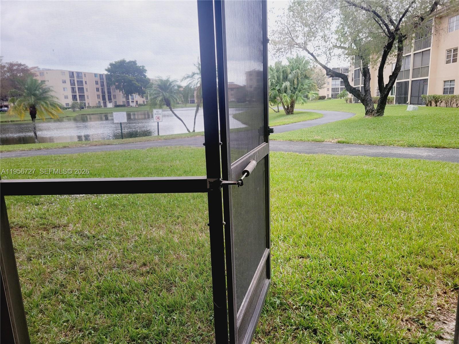 7900 Northwest 50th Street, Unit 108 Lauderhill, FL 33351 - Photo 16 of 18 a view of a garden from a building