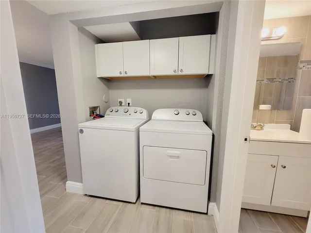 a utility room with dryer and washer