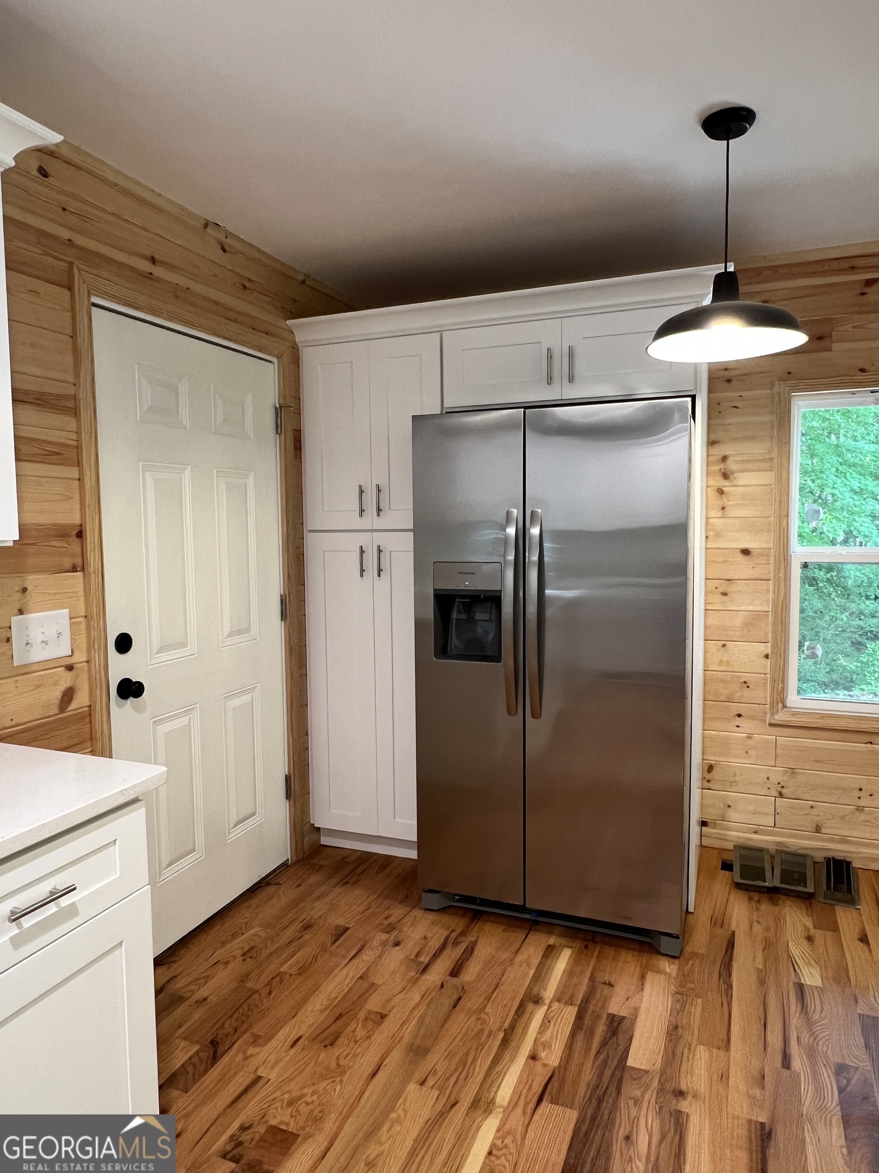 984 Plowshare Road Carrollton, GA 30117 - Photo 6 of 15 a kitchen with kitchen island a counter top space and refrigerator