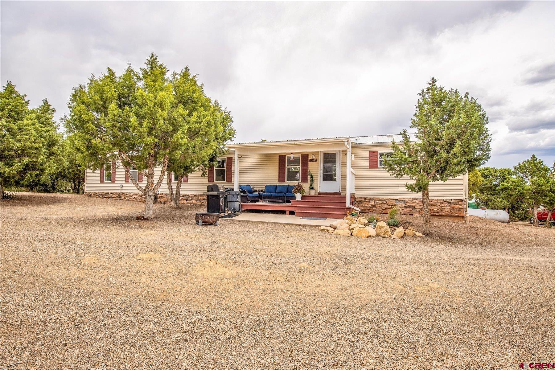 31886 Rd L Mancos, CO 81328 - Photo 1 of 41 a view of a street with houses on both side of the road