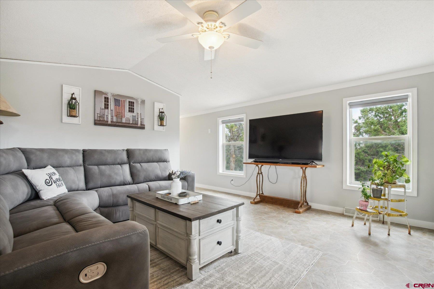31886 Rd L Mancos, CO 81328 - Photo 2 of 41 a living room with furniture and a flat screen tv