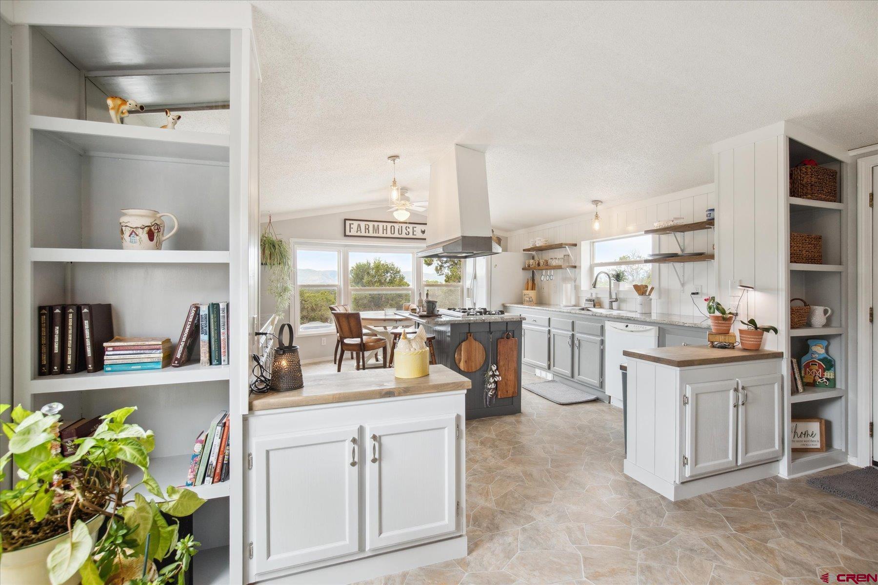 31886 Rd L Mancos, CO 81328 - Photo 7 of 41 a kitchen with cabinets and window