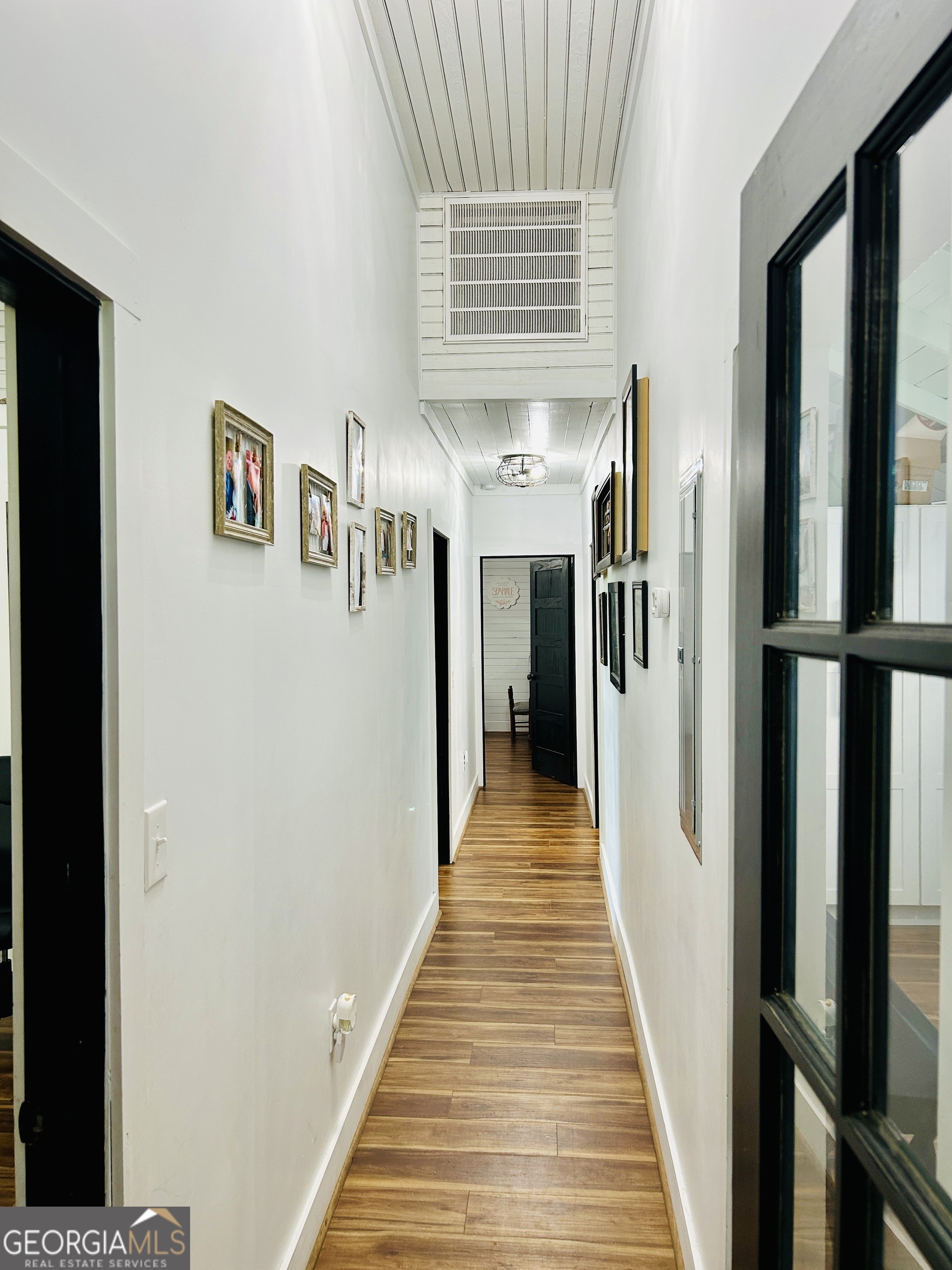 5065 10 Mile Road Baxley, GA 31513 - Photo 20 of 70 a view of a hallway with the wooden floor and staircase