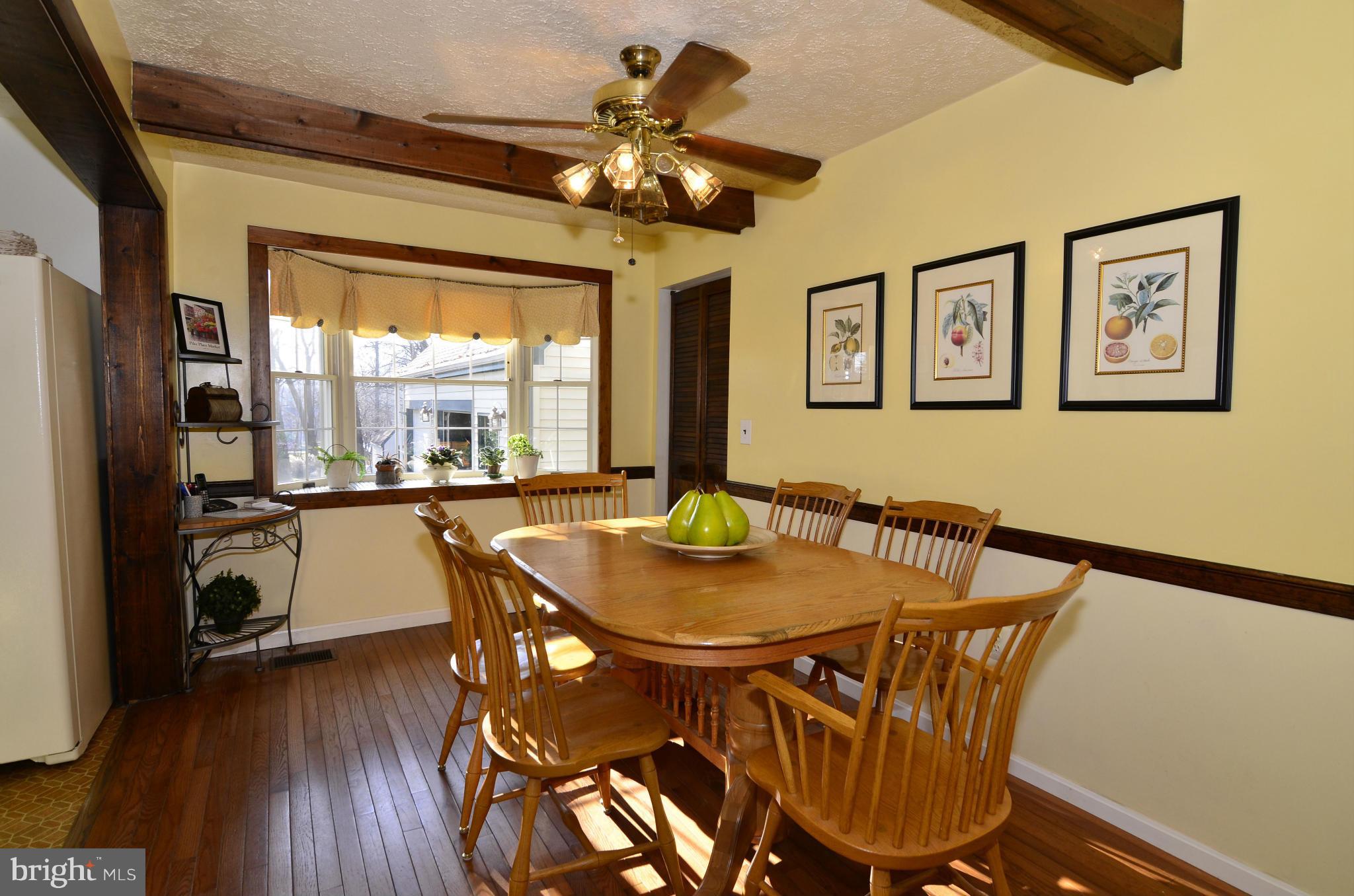 8725 Pohick Road Springfield, VA 22153 - Photo 7 of 22 The dining room has a bay window & hardwoods.