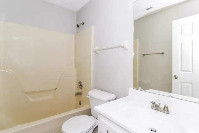 a bathroom with a sink and toilet