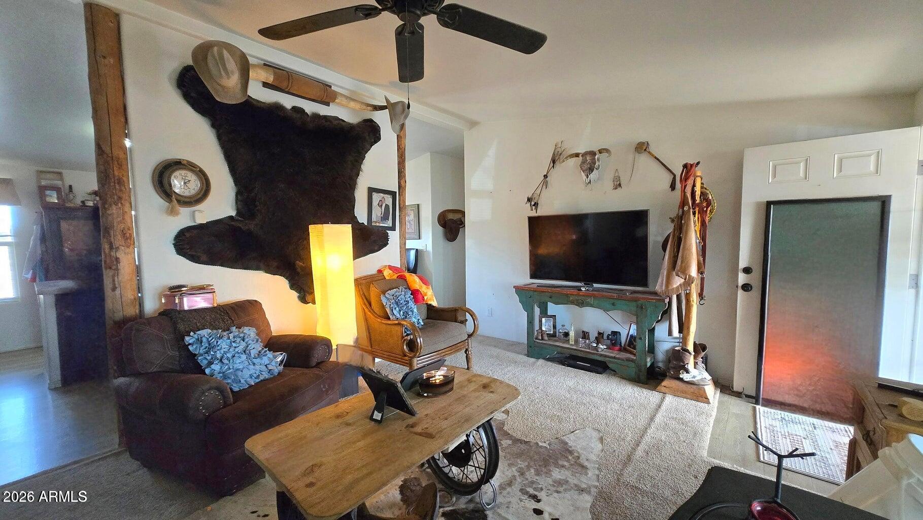 8495 Antelope Run Road Ash Fork, AZ 86320 - Photo 15 of 40 a living room with furniture and a flat screen tv