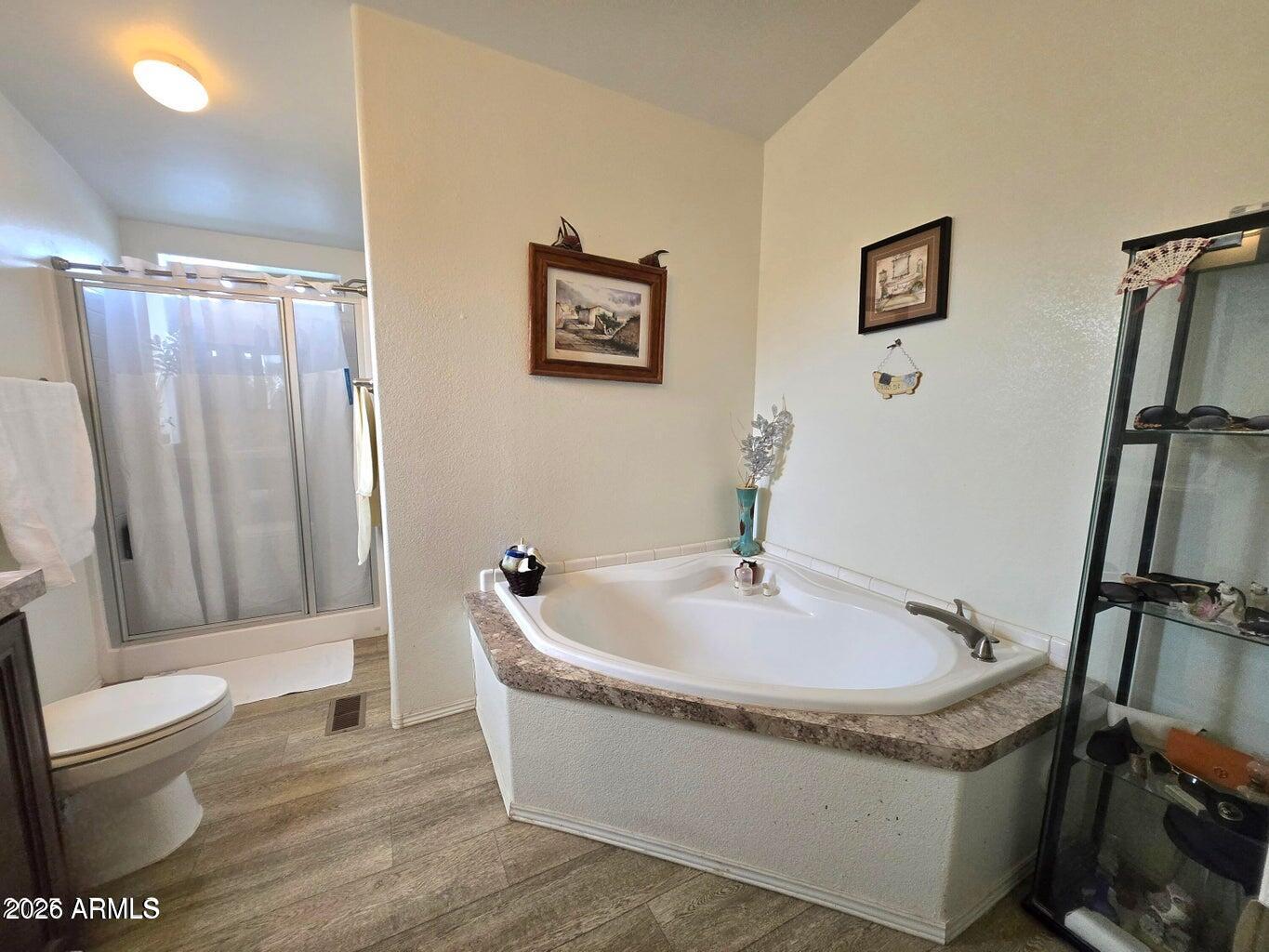 8495 Antelope Run Road Ash Fork, AZ 86320 - Photo 17 of 40 a bath tub sitting next to a white toilet