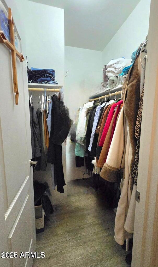 8495 Antelope Run Road Ash Fork, AZ 86320 - Photo 18 of 40 a view of walk in closet with clothes and shoes