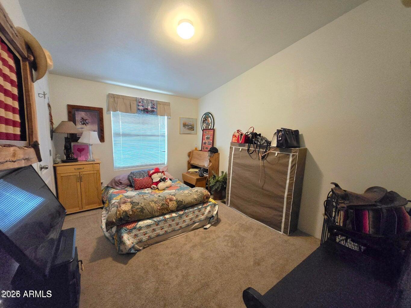 8495 Antelope Run Road Ash Fork, AZ 86320 - Photo 23 of 40 a bedroom with furniture and a bed