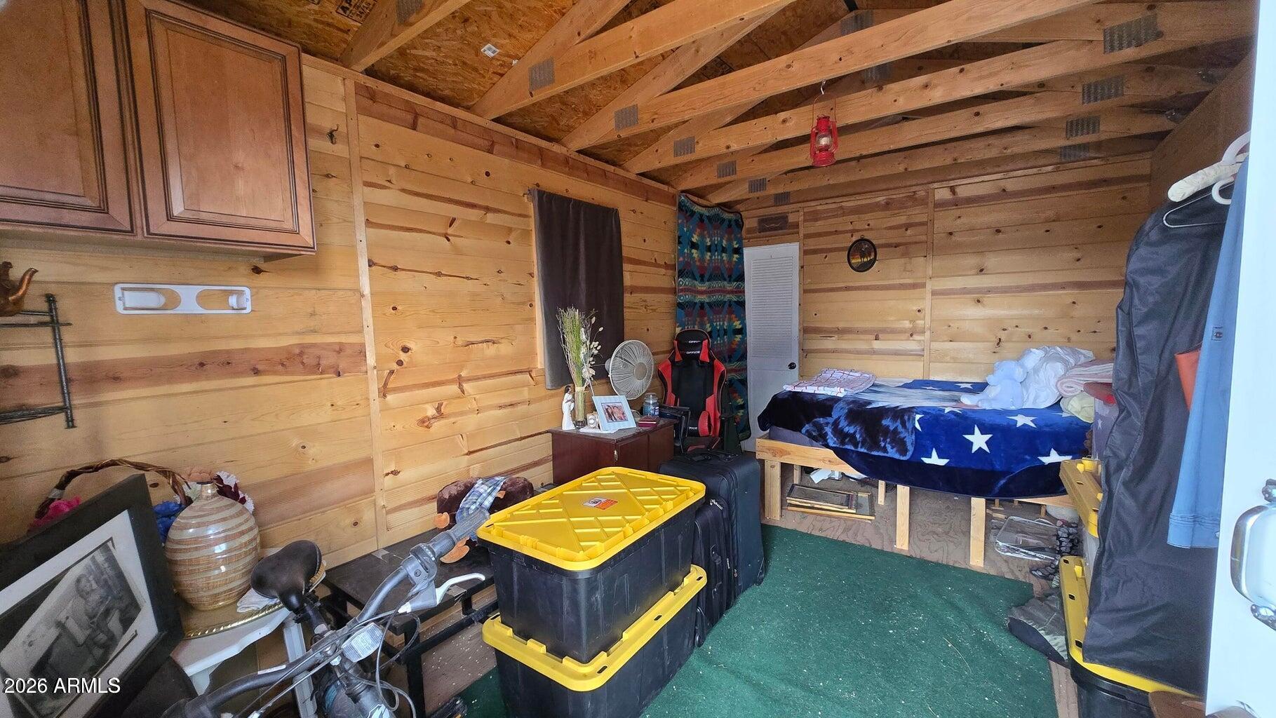 8495 Antelope Run Road Ash Fork, AZ 86320 - Photo 26 of 40 a living room with furniture a rug and a wall painting