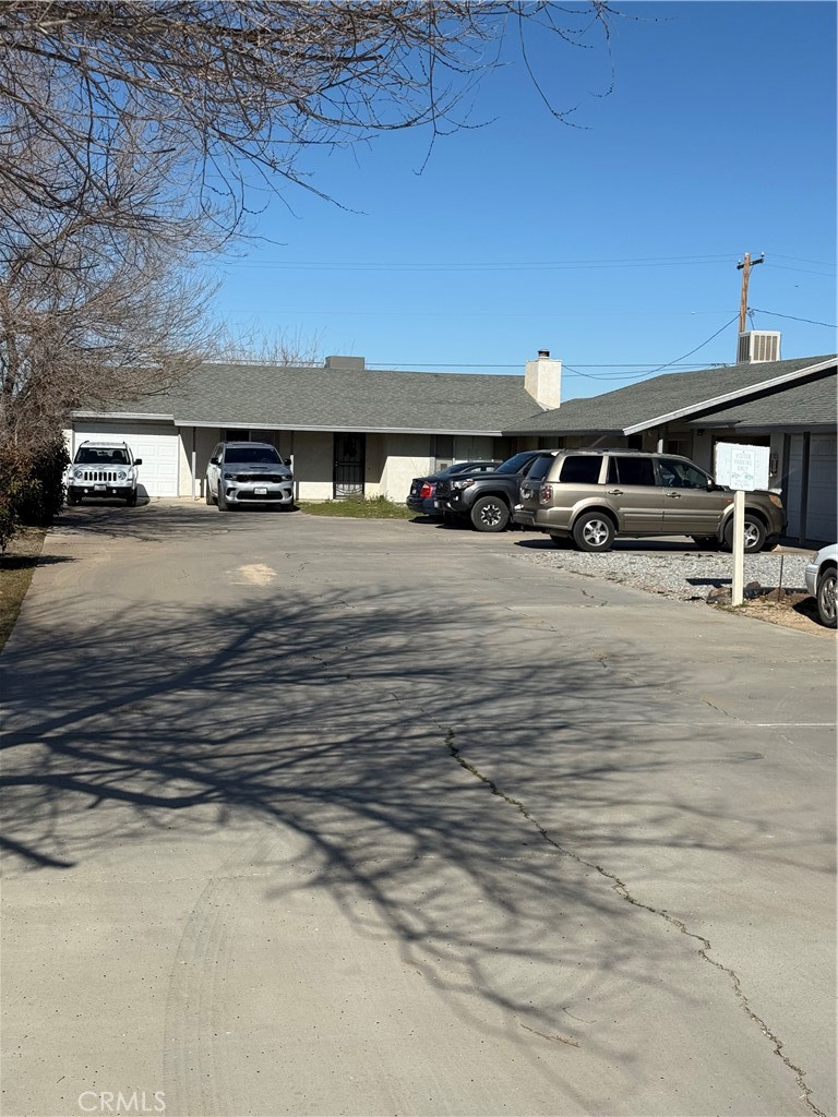 20958 Nisqually Road Apple Valley, CA 92308 - Photo 5 of 11 a view of a car park with an outdoor space