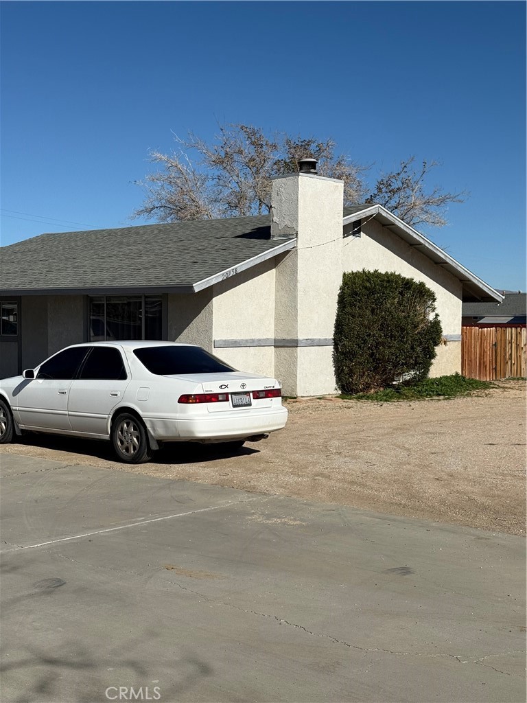 20958 Nisqually Road Apple Valley, CA 92308 - Photo 6 of 11 a view of parking space with cars parked
