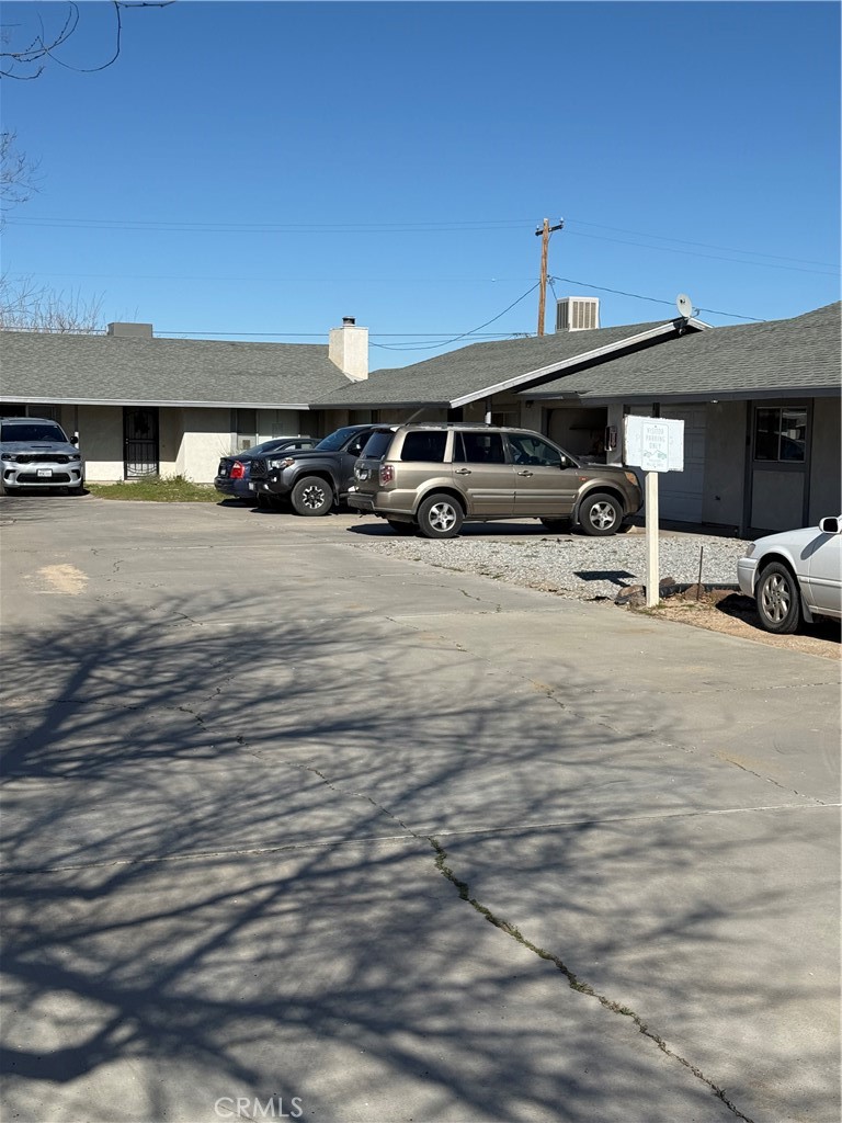 20958 Nisqually Road Apple Valley, CA 92308 - Photo 8 of 11 a car parked in front of a building