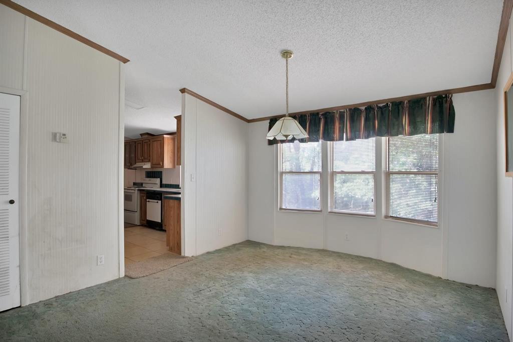 318 Bavarian Road Waco, TX 76705 - Photo 12 of 26 a view of empty room with floor to ceiling window and cabinet