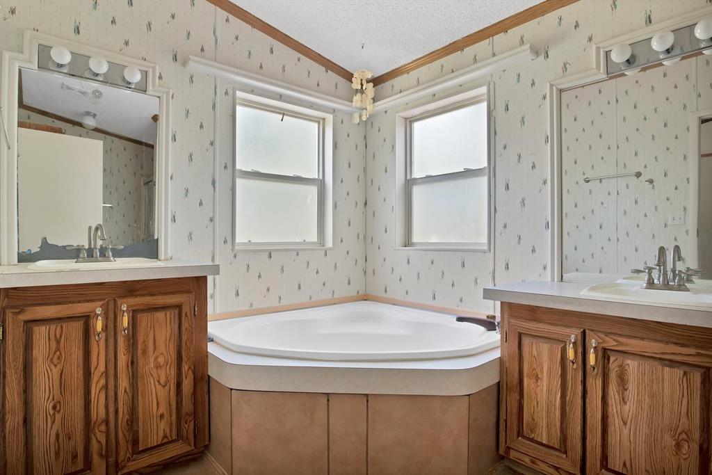 318 Bavarian Road Waco, TX 76705 - Photo 17 of 26 a bathroom with a sink and a mirror