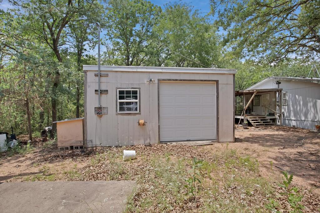 318 Bavarian Road Waco, TX 76705 - Photo 22 of 26 a view of a house with a yard and garage