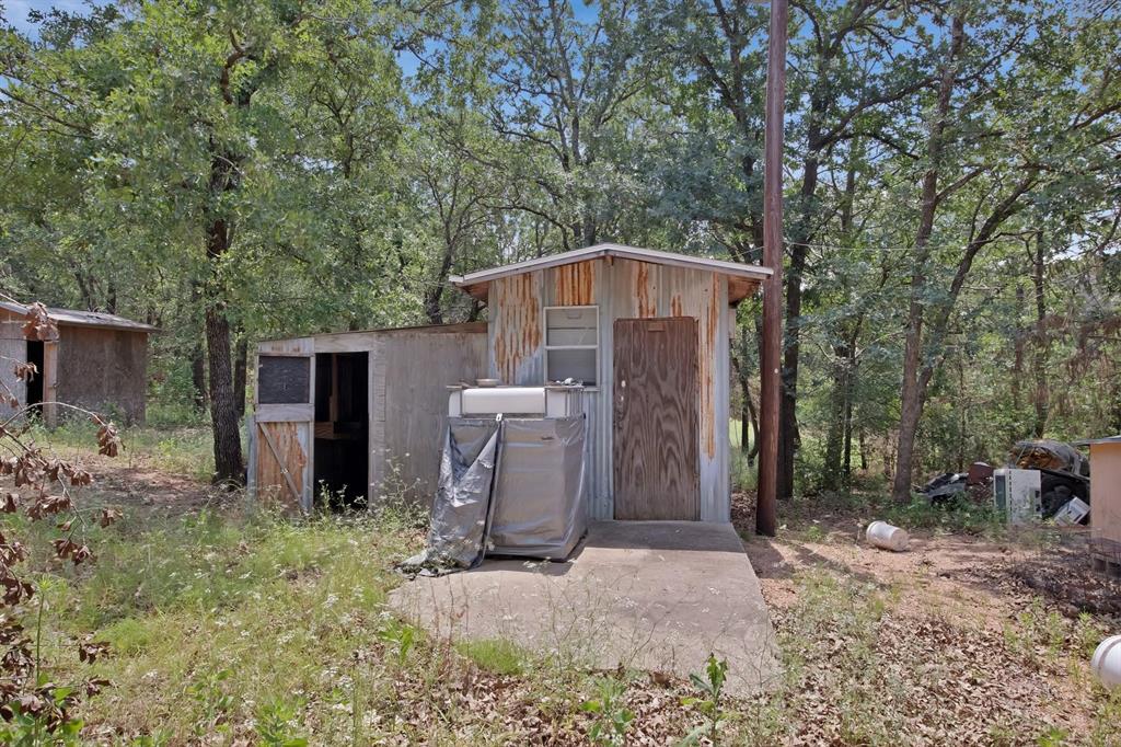 318 Bavarian Road Waco, TX 76705 - Photo 24 of 26 a front view of house with yard and trees