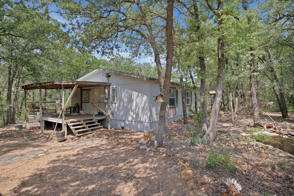 318 Bavarian Road Waco, TX 76705 - Photo 4 of 26 a house with trees in front of it