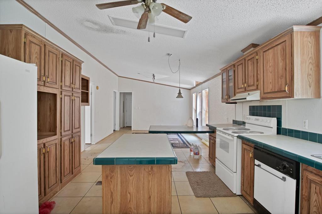318 Bavarian Road Waco, TX 76705 - Photo 8 of 26 a kitchen with stainless steel appliances granite countertop a refrigerator a stove and a sink