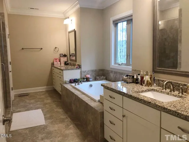 a bathroom with a granite countertop sink mirror and double